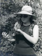 Photograph of Hilary Gee holding a boa snake